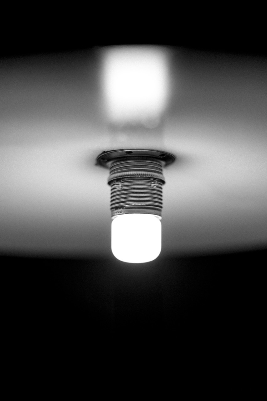 1895 Lamp — lit bulb under the shade