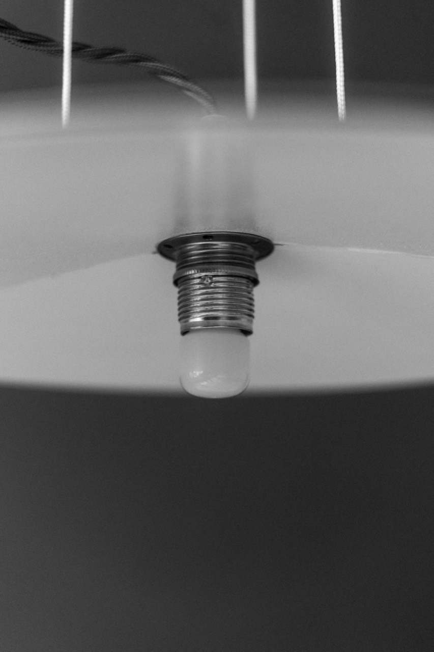 1895 Lamp — bulb and socket detail beneath the shade