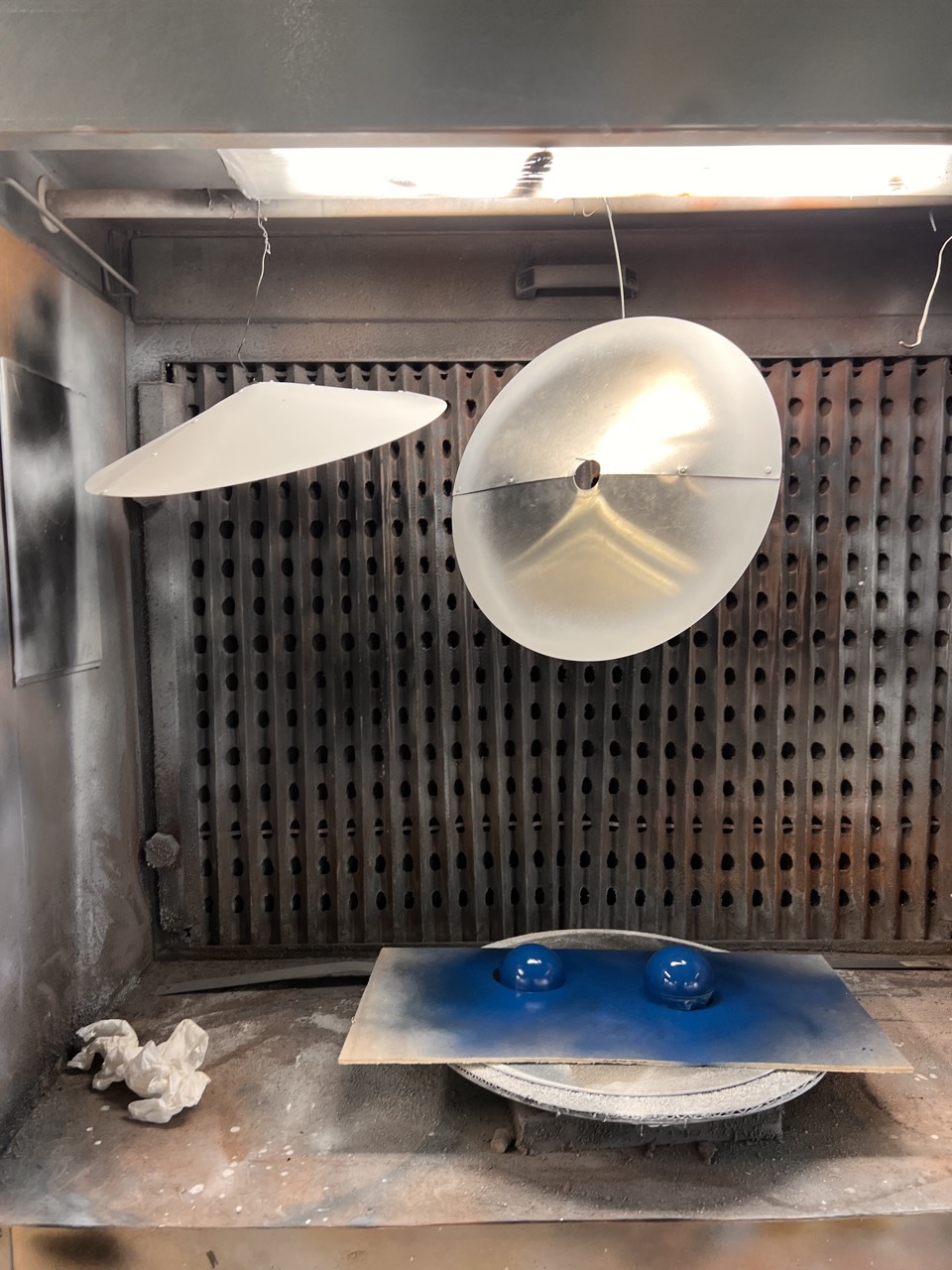 1895 Lamp — shade halves and counterweights in the paint booth