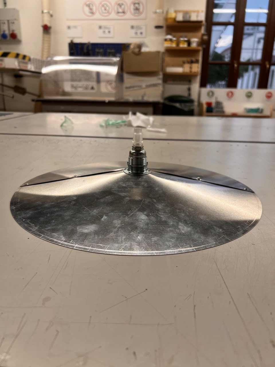 1895 Lamp — raw stainless steel shade prototype in the workshop