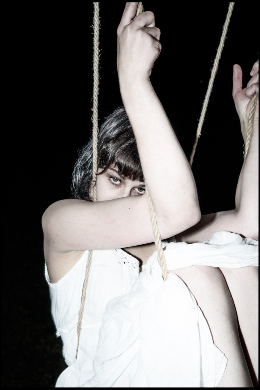 Tied — close portrait of Anfisa holding the rope