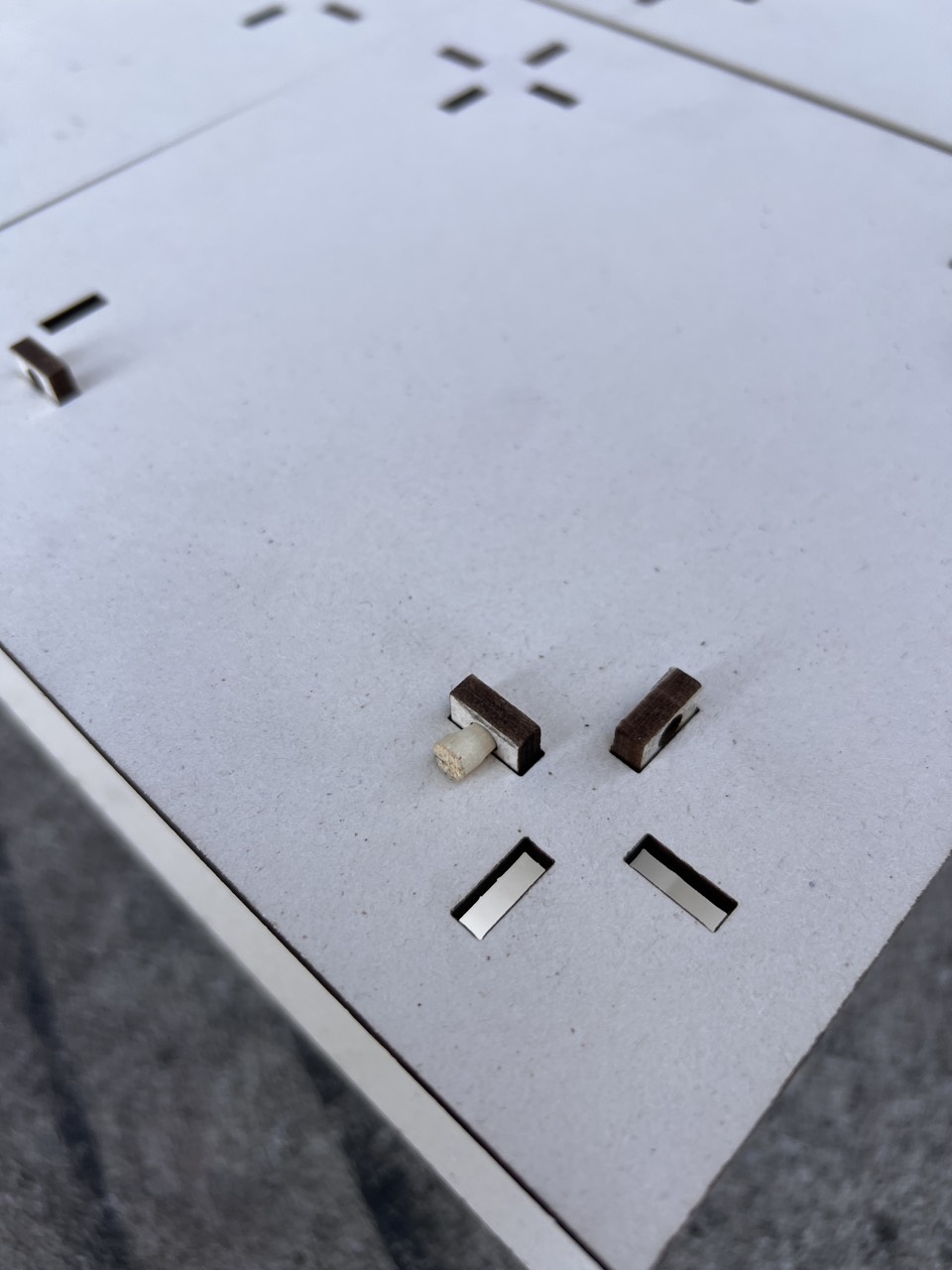 CRUX — detail of the grid cutouts and connector pieces