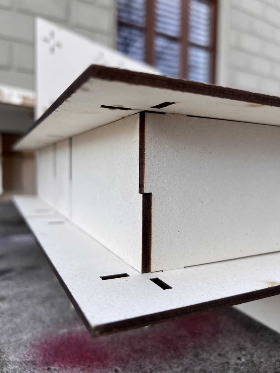 CRUX — slotted joint between table panels, close-up