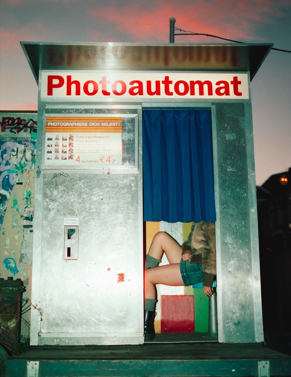 Differences — Photoautomat booth at dusk, on CineStill 800T