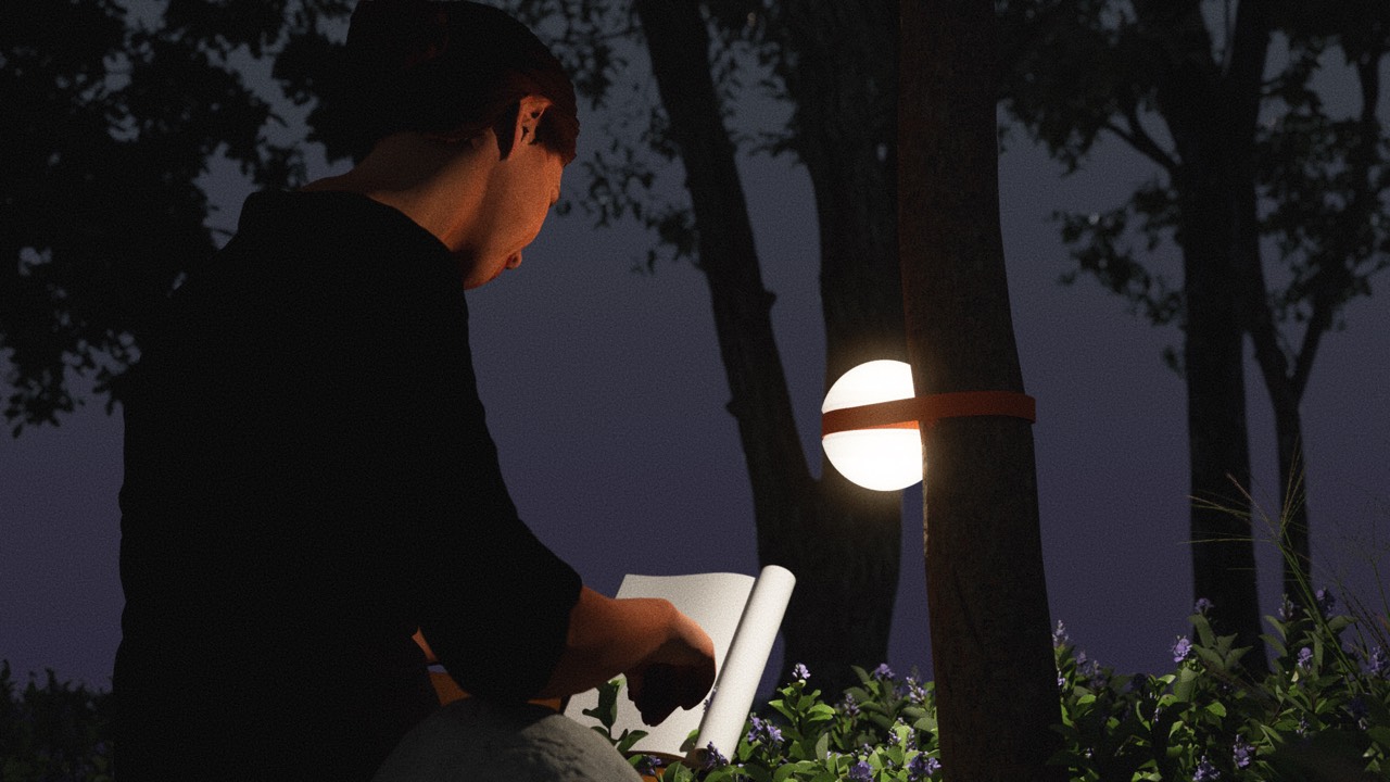 HEMI lamp strapped to a tree, lighting an outdoor workspace at night