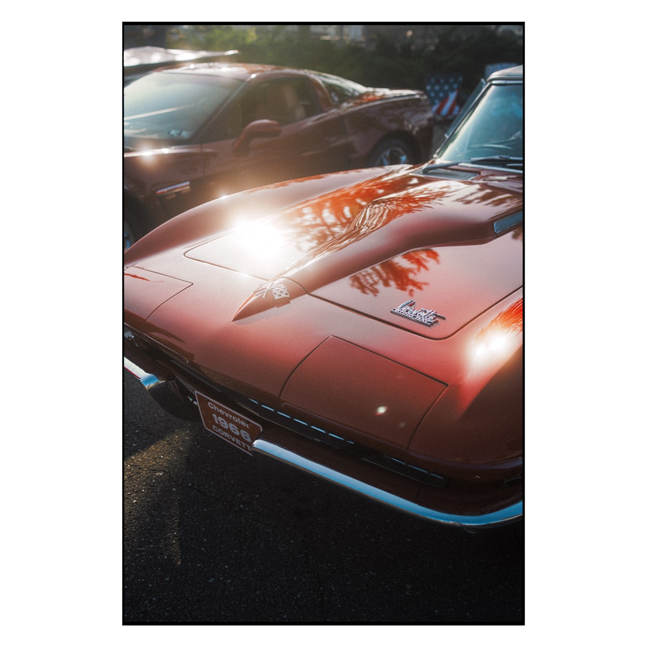 Lake Erie — sunlight on the hood of a red classic car