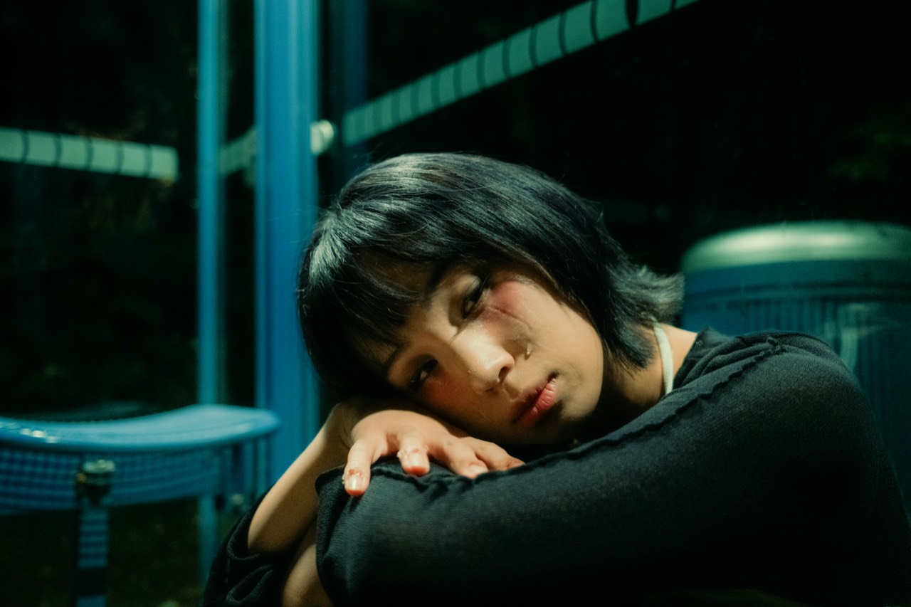 Madame Butterfly — night portrait of Jenny resting her head on her arm